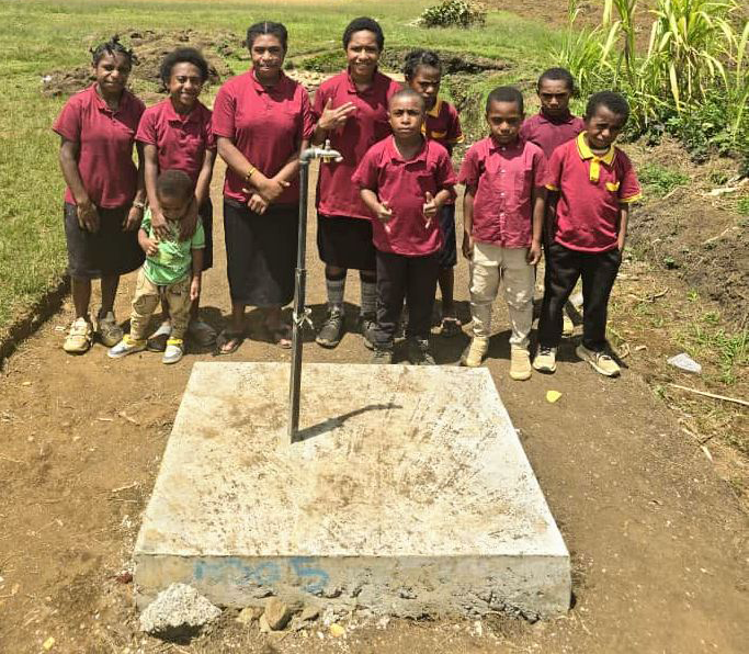 Students waiting in front of the school’s water tap. – Pictures supplied