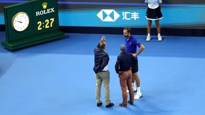 Russia's Daniil Medvedev speaks with officials after he hit a ball into the crowd during his semi-final match against Serbia's Novak Djokovic (REUTERS)
